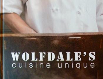 Wolfdales name on wood with chef in background